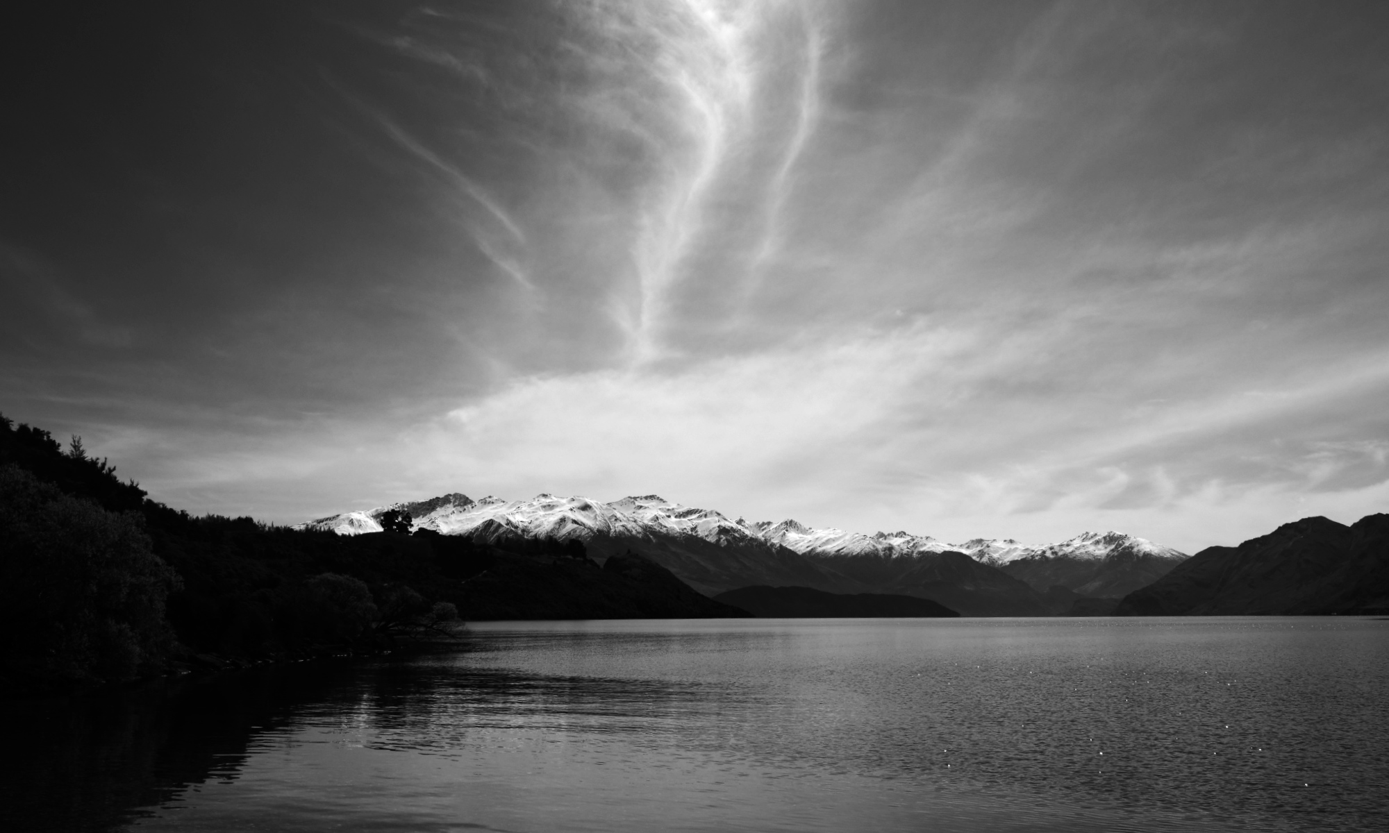 Lake Wanaka black & white image looking at Buchanan range and mountains