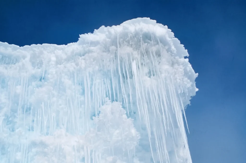 an ice cliff and icicles on the tongue of the Barn Glacier in Antarctica